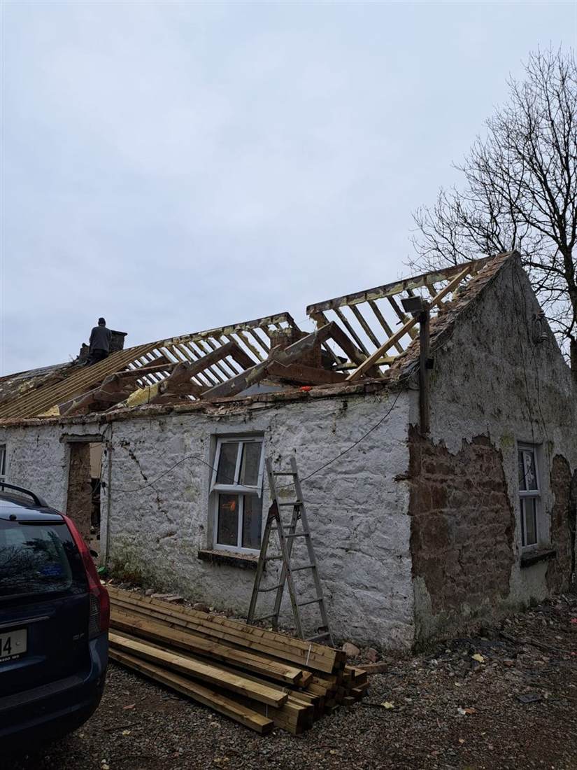 Slate roof being replaced